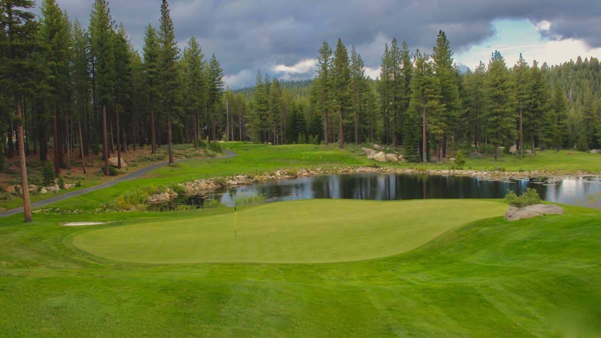 Hole 16 at Coyote Moon with sand bunkers and water feature Hole 16 at Coyote Moon with sand bunkers and water feature