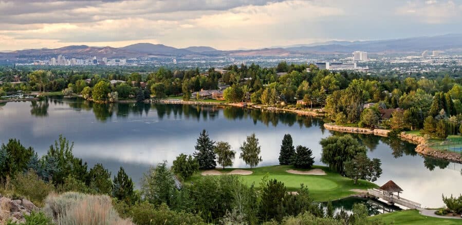 LakeRidge Golf Course wide panorama with lake, fairways, and Reno city backdrop LakeRidge Golf Course wide panorama with lake, fairways, and Reno city backdrop