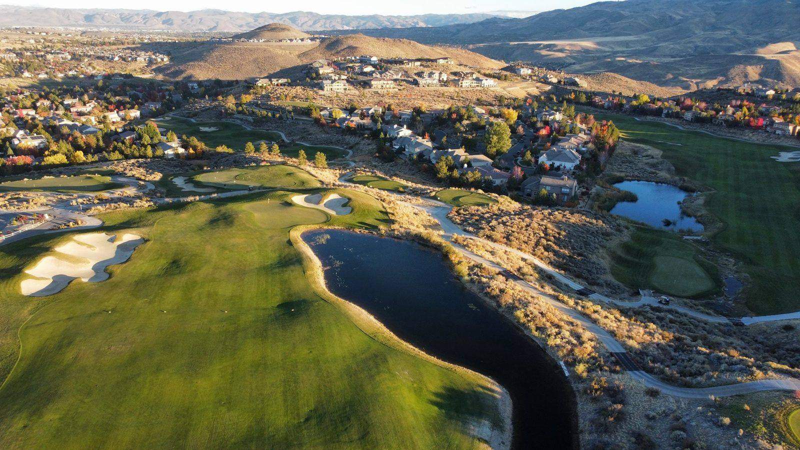 Somersett Golf & Country Club — aerial view of the course with reno landscape Somersett Golf & Country Club — aerial view of the course with reno landscape