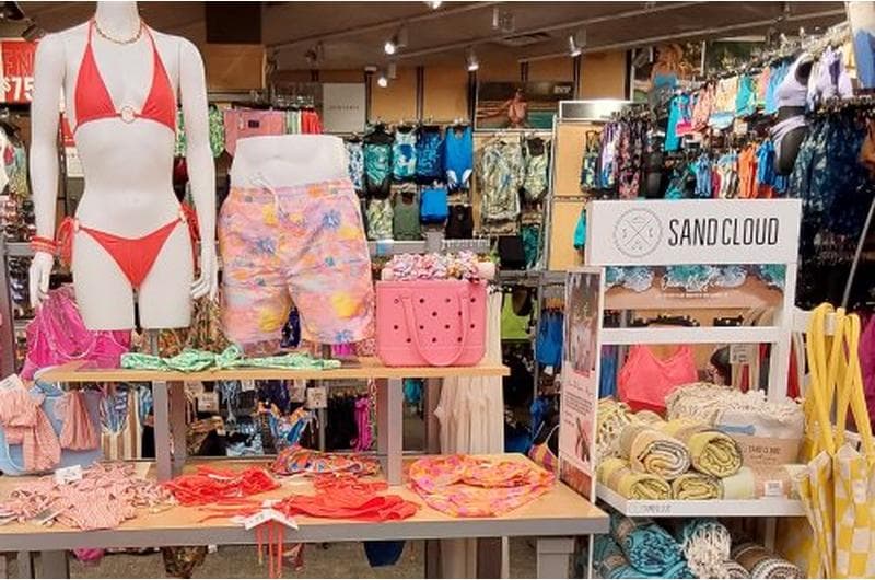 SCHEELS Sparks retail interior featuring aquariums, indoor Ferris wheel, and themed store displays