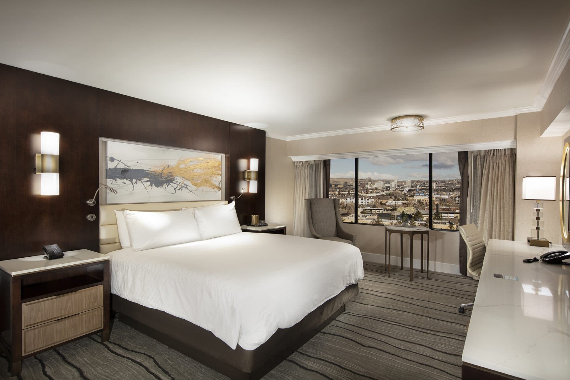 Peppermill Deluxe King Room at Peppermill Resort Spa Casino — guest suite amenities