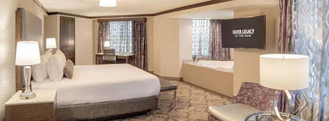 Silver Legacy Vista Room – 1 King at Silver Legacy Resort Casino — bedroom with premium bedding