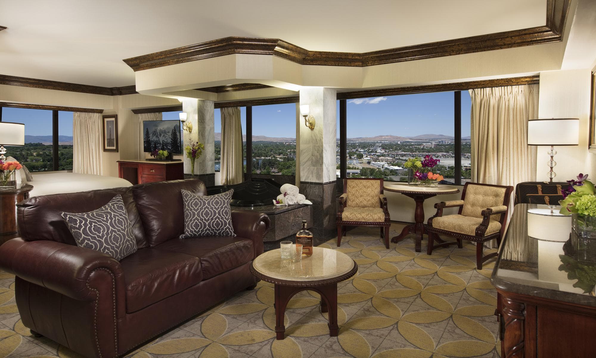 Peppermill Luxury Suite at Peppermill Resort Spa Casino — bedroom with premium bedding