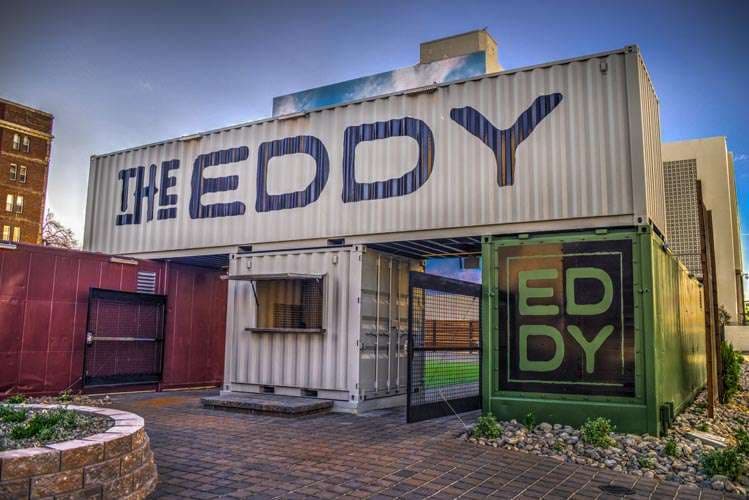 The Eddy Reno AM beer garden atmosphere with outdoor seating along Truckee River