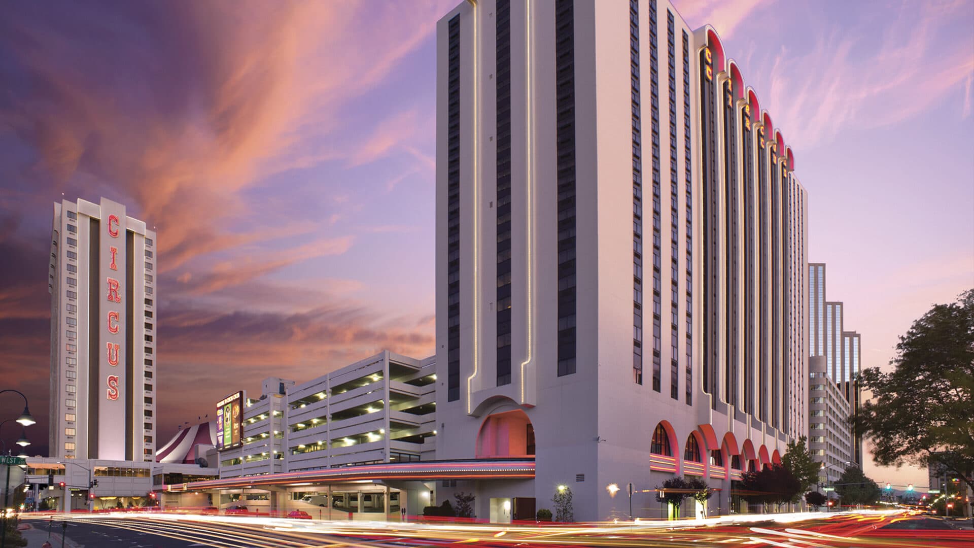 Circus Circus Reno — iconic pink and white tower exterior at dusk, part of The Row Reno Circus Circus Reno — iconic pink and white tower exterior at dusk, part of The Row Reno