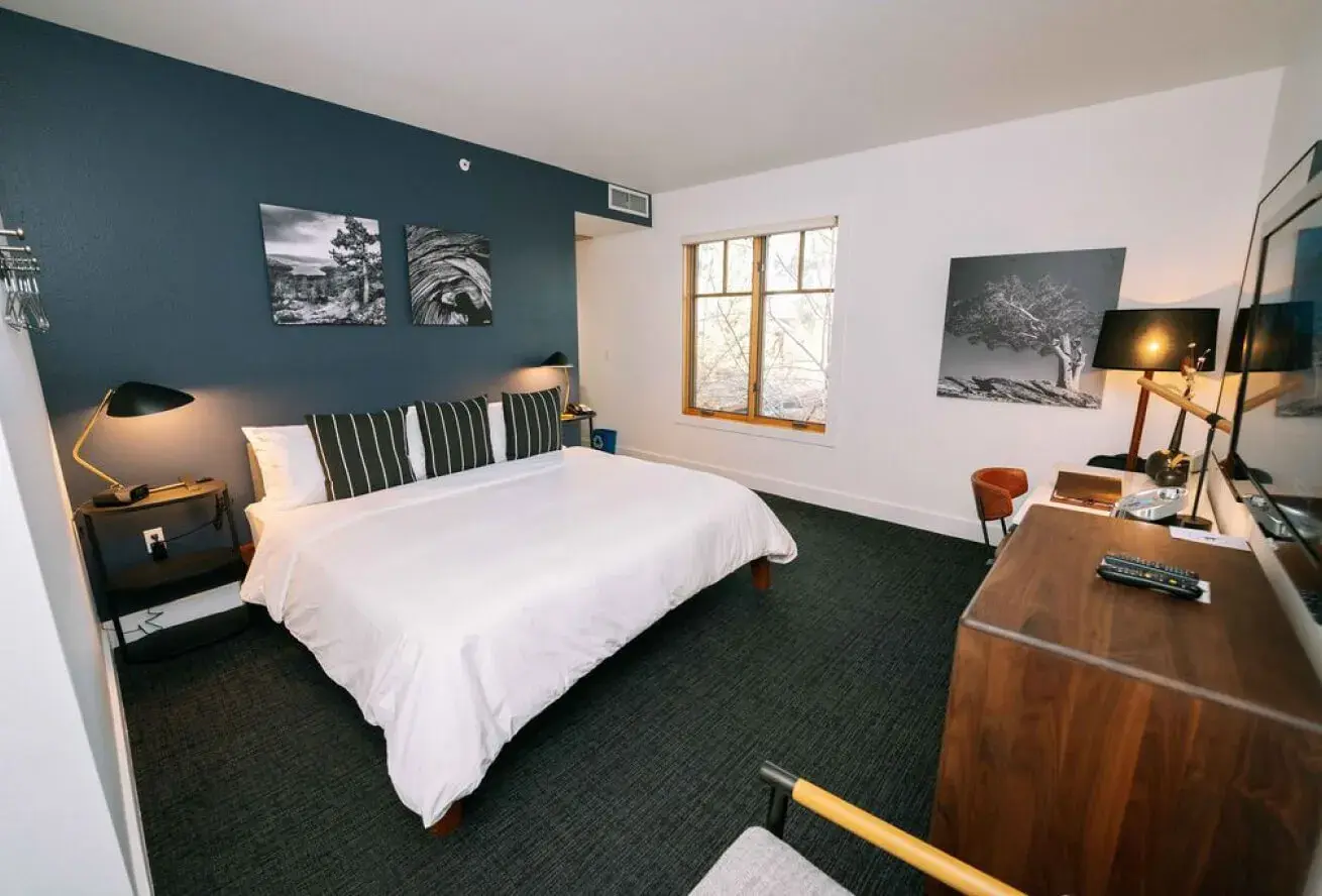 Gravity Haus Truckee guest room — modern mountain-contemporary decor with black-and-white ski-country photography