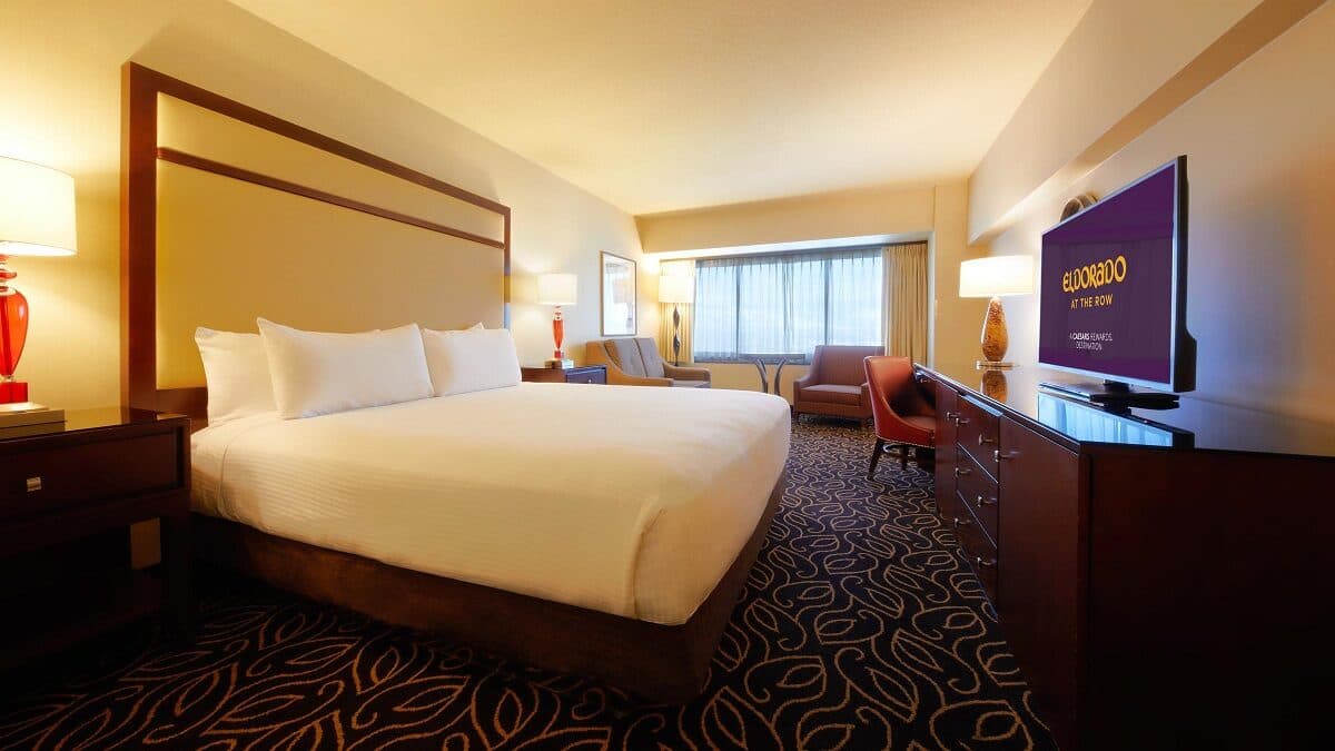 Skyline Deluxe Room at Eldorado Reno — 1 King bed with mid-tone wood furniture