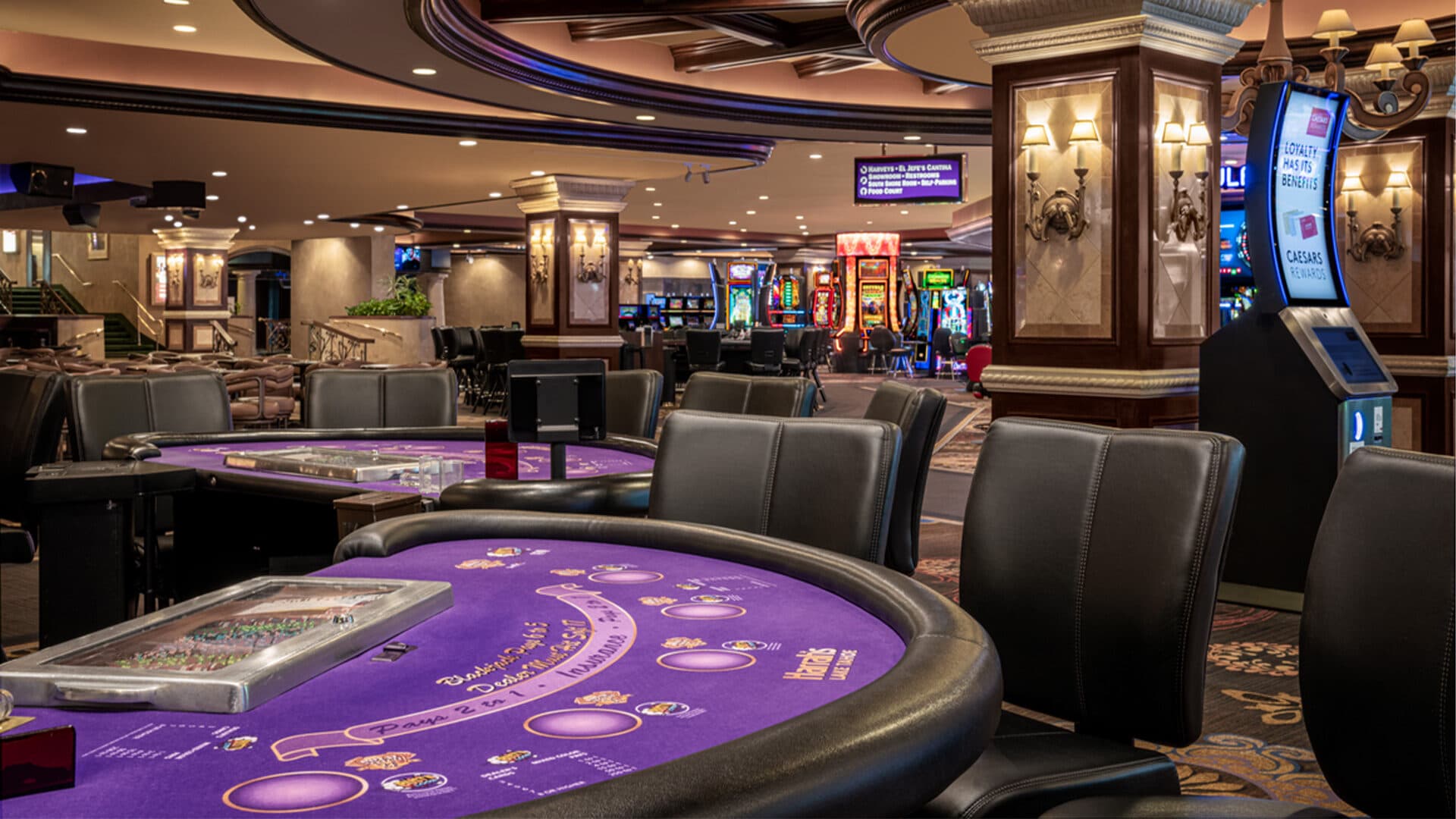 Harrah's Lake Tahoe casino floor with table games and guests