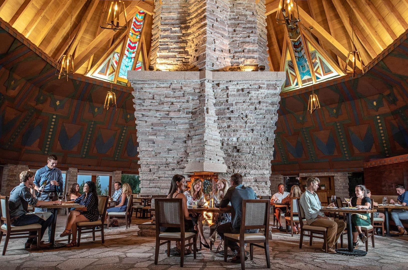 Fifty44 dining room at The Lodge at Nakoma — iconic tipi-roof interior with stone fireplace