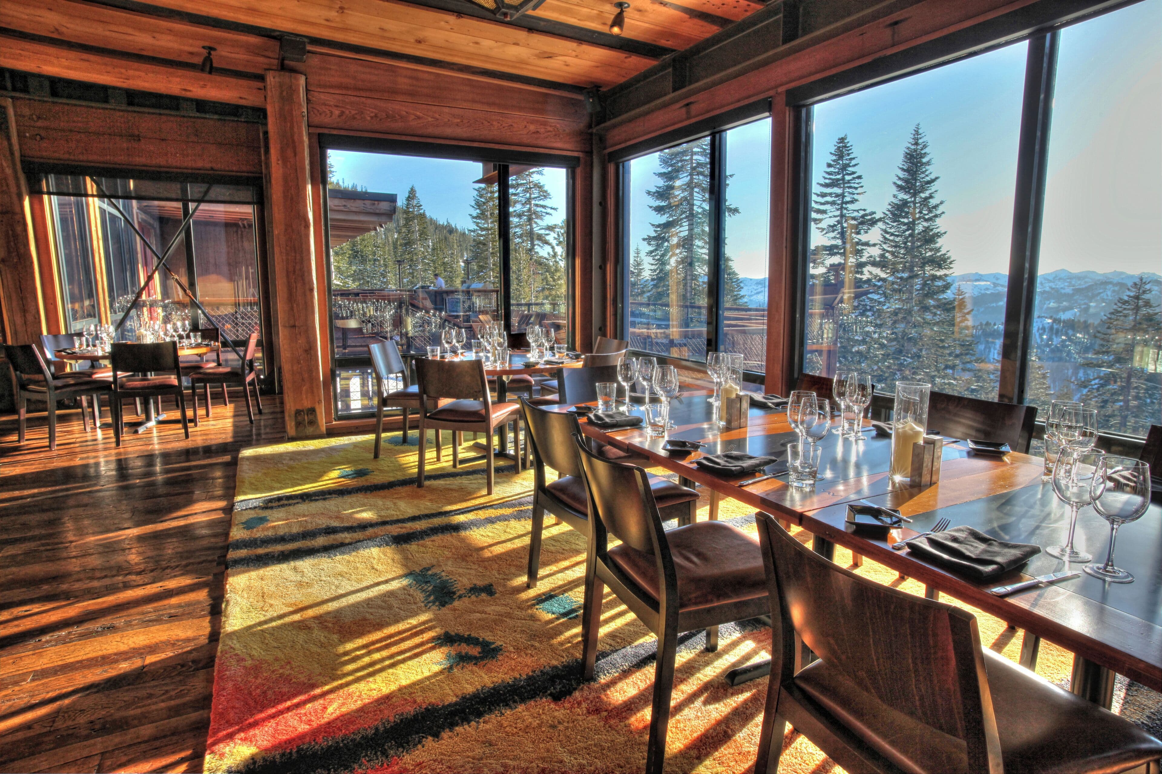 Bearfoot Bar & Grill interior with floor-to-ceiling mountain view windows at Old Greenwood, Truckee