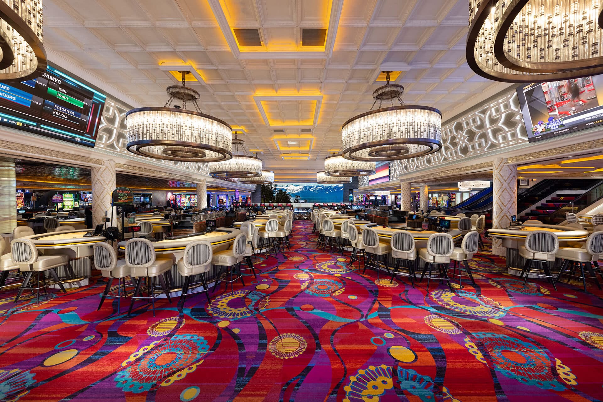 Main Peppermill casino floor — 82,000 sq ft of slots and table games under ornate chandeliers