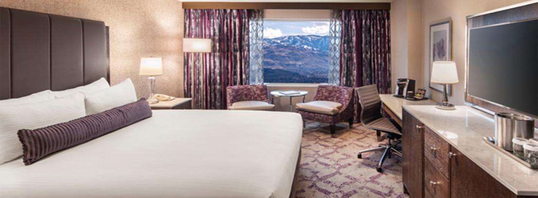 Silver Legacy Players Premium Room – 2 Queen at Silver Legacy Resort Casino — guest room with upscale furnishings and contemporary decor