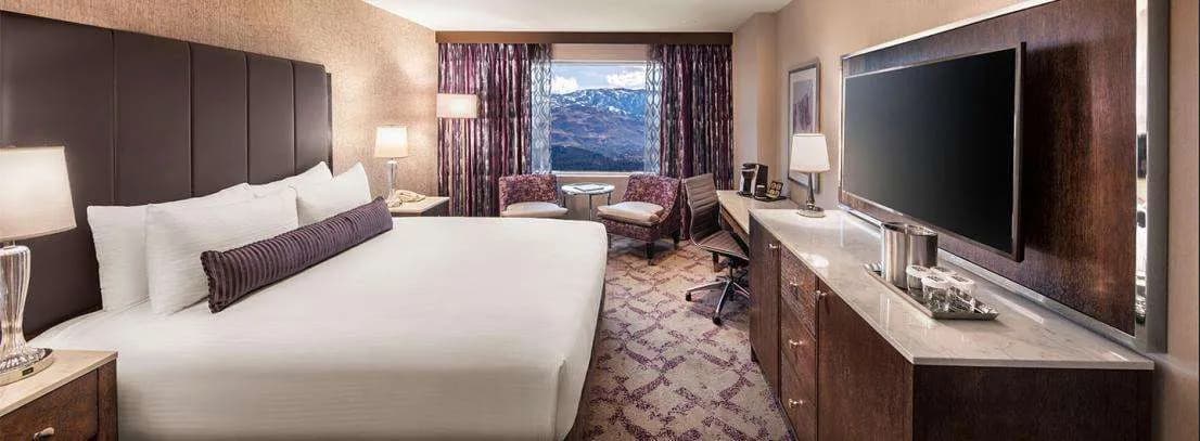 Silver Legacy Deluxe Spa Suite – 1 King at Silver Legacy Resort Casino — guest room with upscale furnishings and contemporary decor